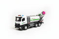 Model cement mixer truck with green and red lights on a plain background